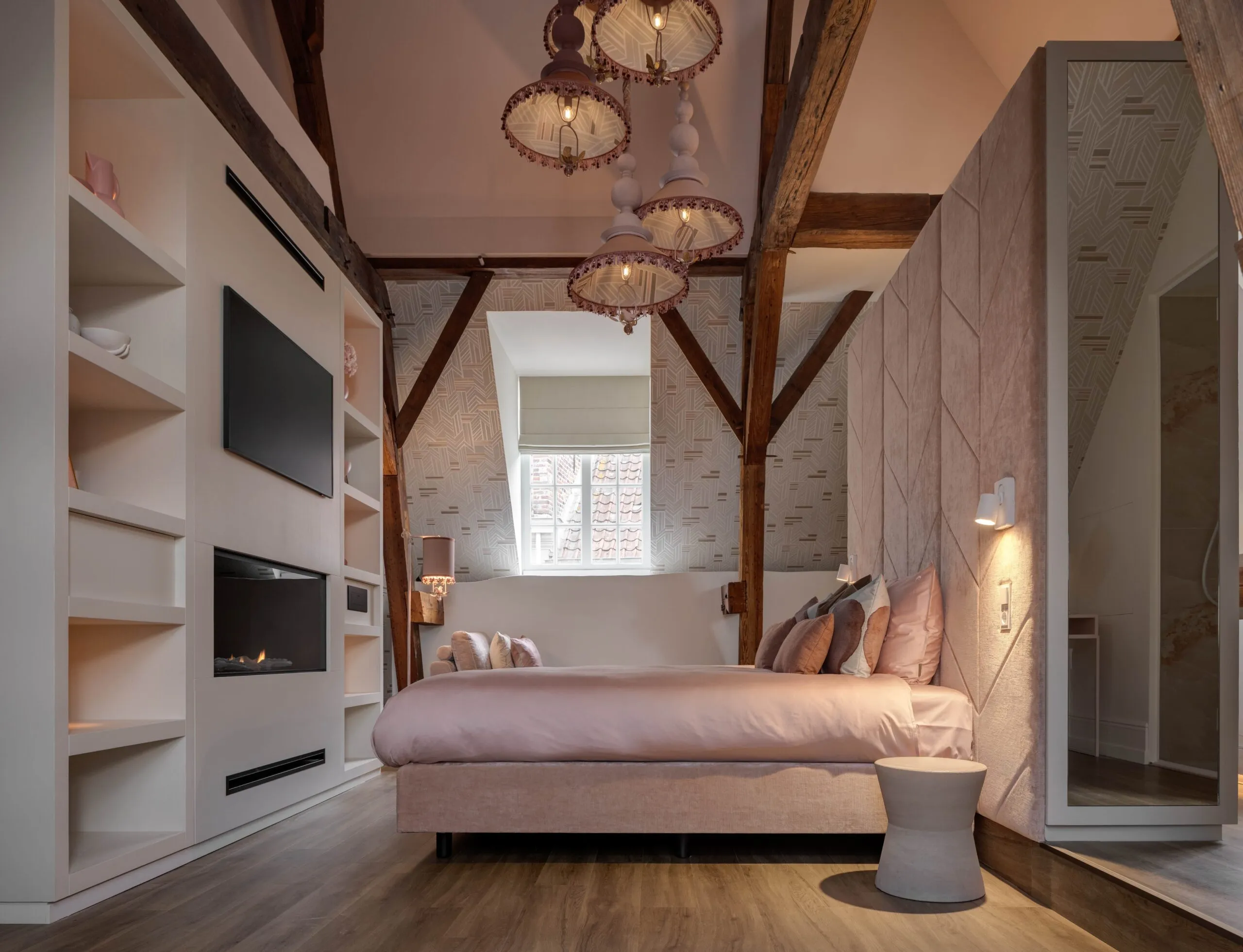 books, a vase, a candle, a tea mug on the table