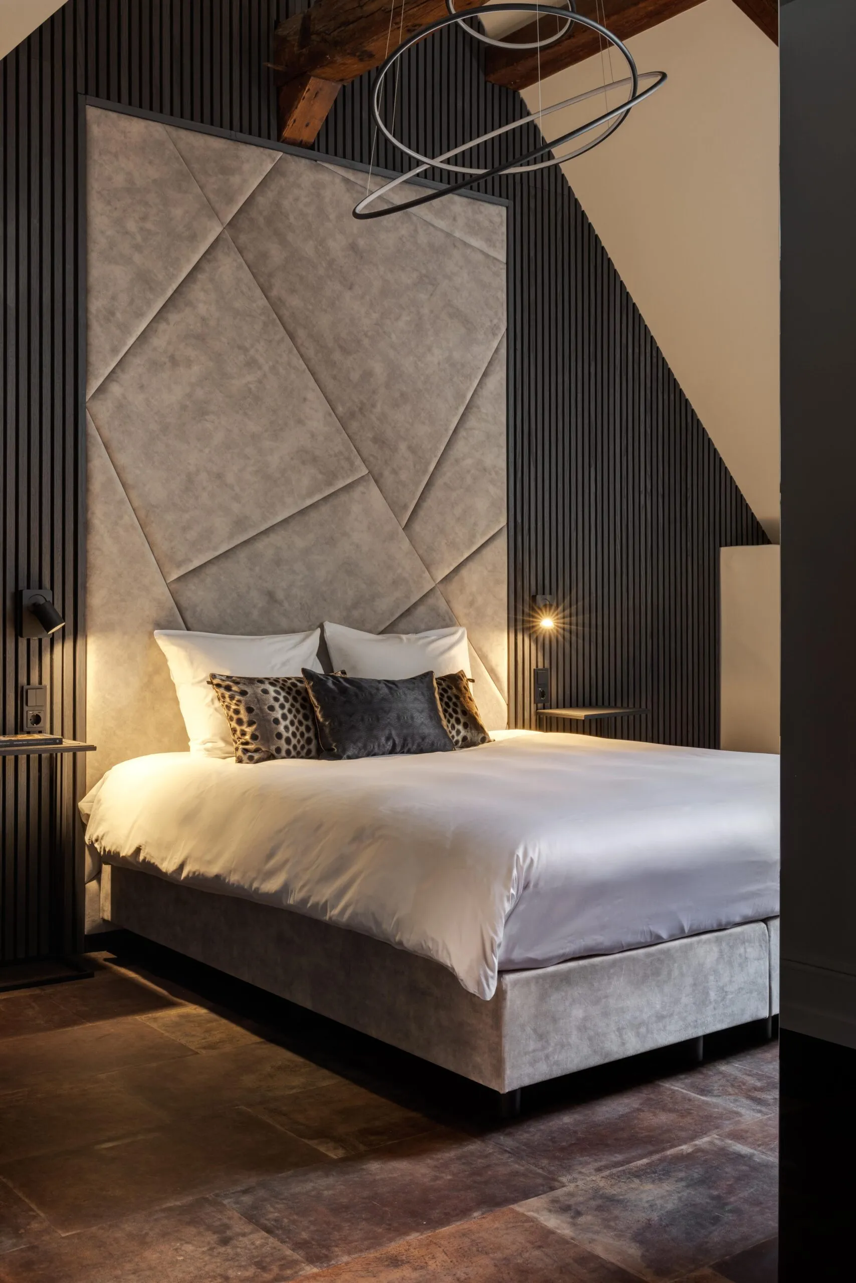 room with wooden floor, light walls, mirror